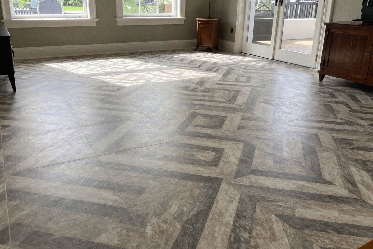 Illustrative image: Large living room with geometric patterned floor in natural light
