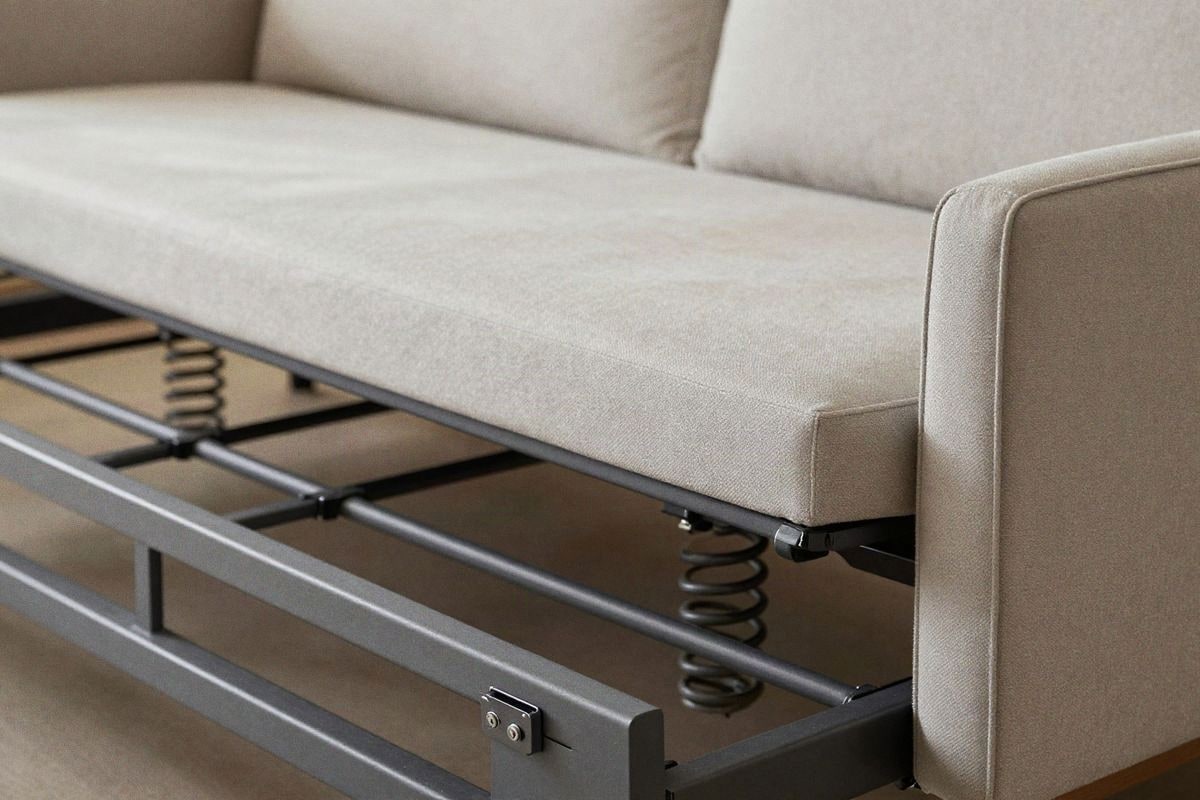 Imagen ilustrativa: detalle de mecanismo interno de sofá cama con estructura metálica resistente.